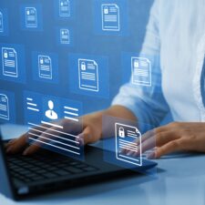 Employee icons floating above laptop | Best intranet software