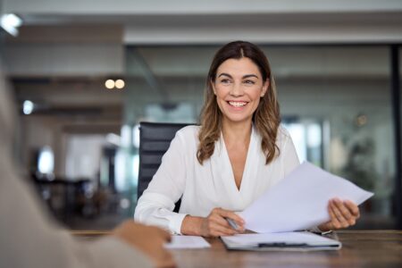 HR leader reviewing her team’s performance | How to improve employee engagement