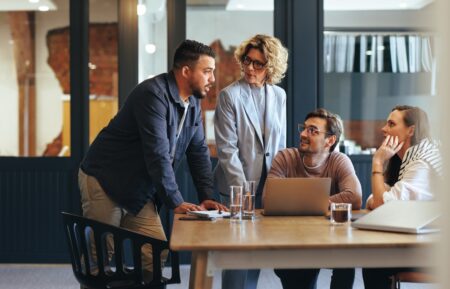 Employees collaborating and designing an intranet | Intranet vs. digital workplace